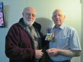 Allan Sheppard (left) receives Pte. William Sheppard's medal from MRNZ's Brian Ramsay.